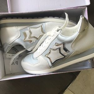 White tennis shoes metallic star detail